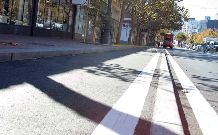 One stretch of the test-case raised bike lane employs a more perpendicular edge to prevent incursions by motor vehicles.