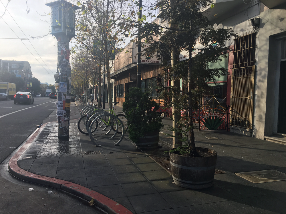 This SF bulb-out shows how they extend the sidewalk and create more space for bike parking and other amenities. 