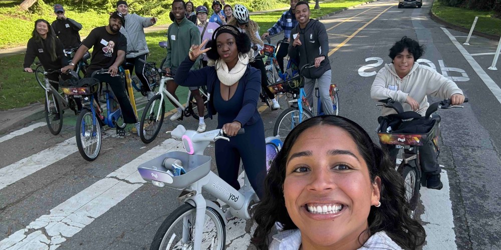 a group of people smile on bikes